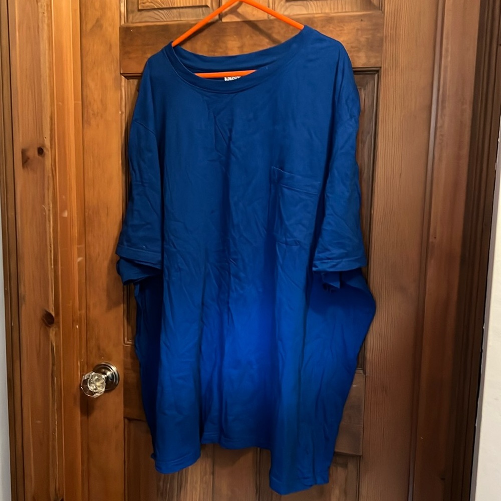 Mens royal blue I believe be short sleeve ent shirt with pockets Tom the front.